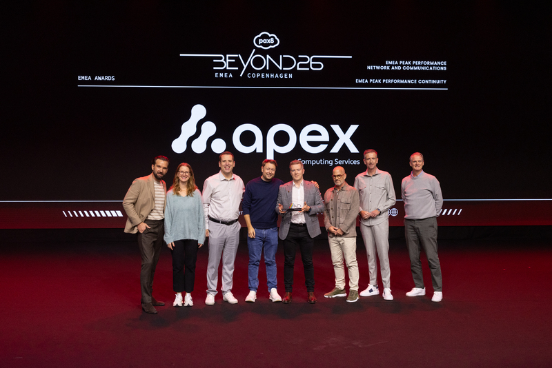 Apex Computing Manchester IT Support team receiving the Network and Communications Award at Pax8 Beyond EMEA awards in Copenhagen